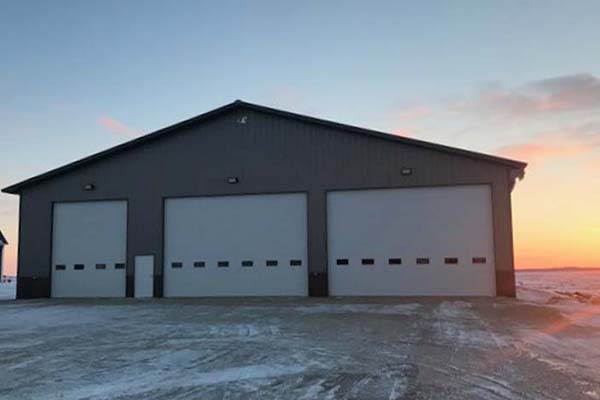 You are currently viewing Top 5 Winter Maintenance Tips For Commercial Garage Doors | Overhead Door Company in Rochester, MN